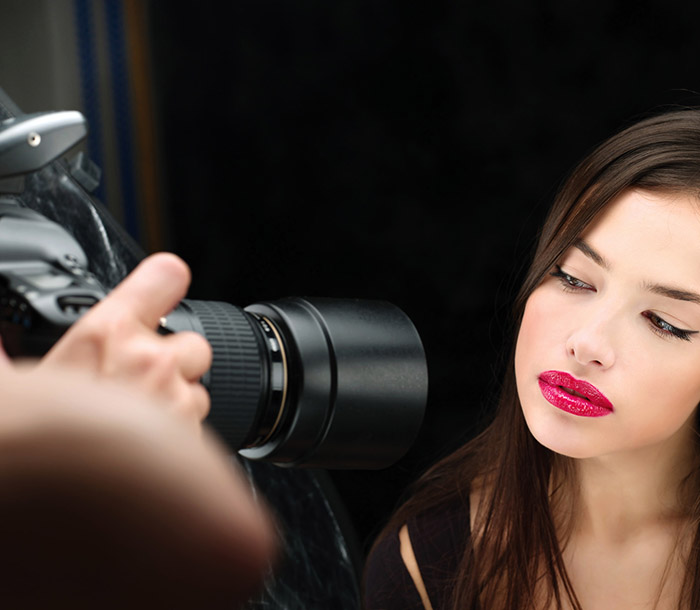 Pretty female model on photo shooting in studio